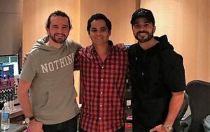 Salda with "Despacito" singer Luis Fonsi and co-producer Andres Torres